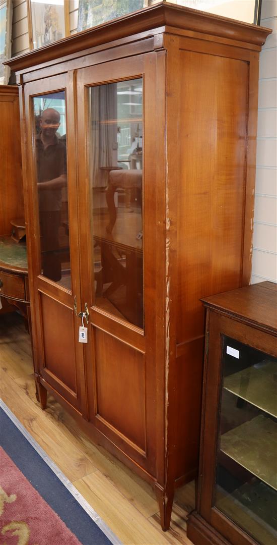 A pair of French federal-style cherrywood glazed bookcases W.122cm